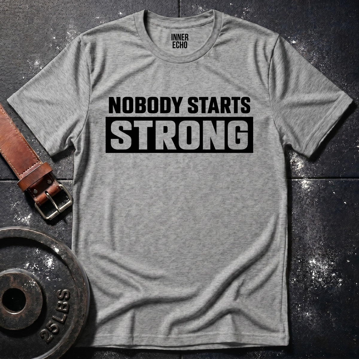 NOBODY STARTS STRONG — T-Shirt