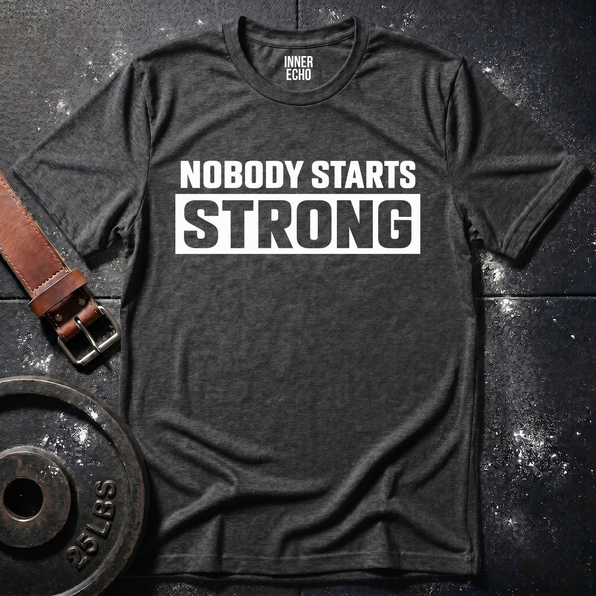 NOBODY STARTS STRONG — T-Shirt