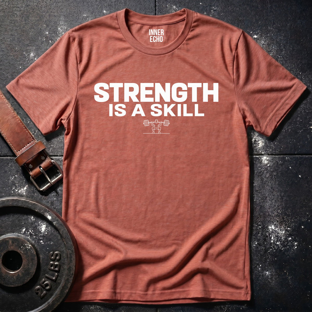STRENGTH IS A SKILL — T-Shirt