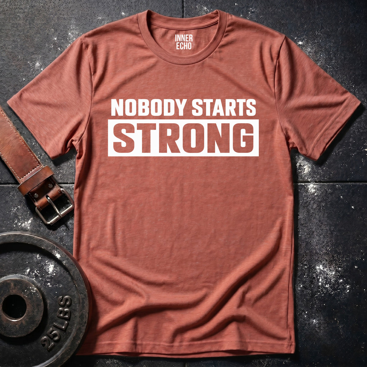 NOBODY STARTS STRONG — T-Shirt