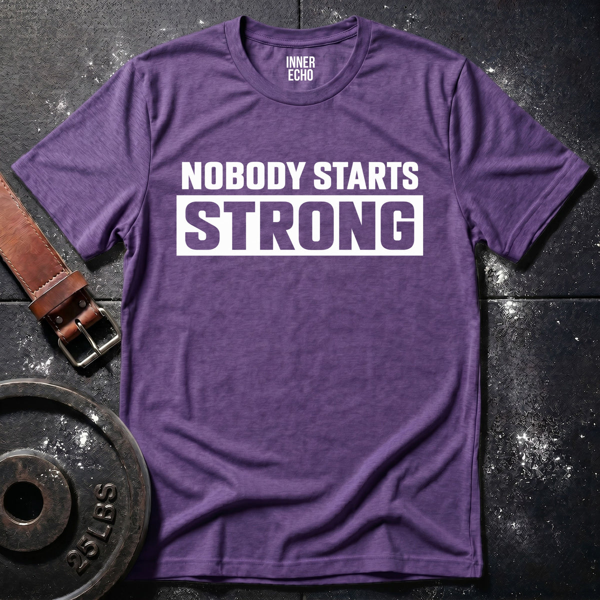 NOBODY STARTS STRONG — T-Shirt