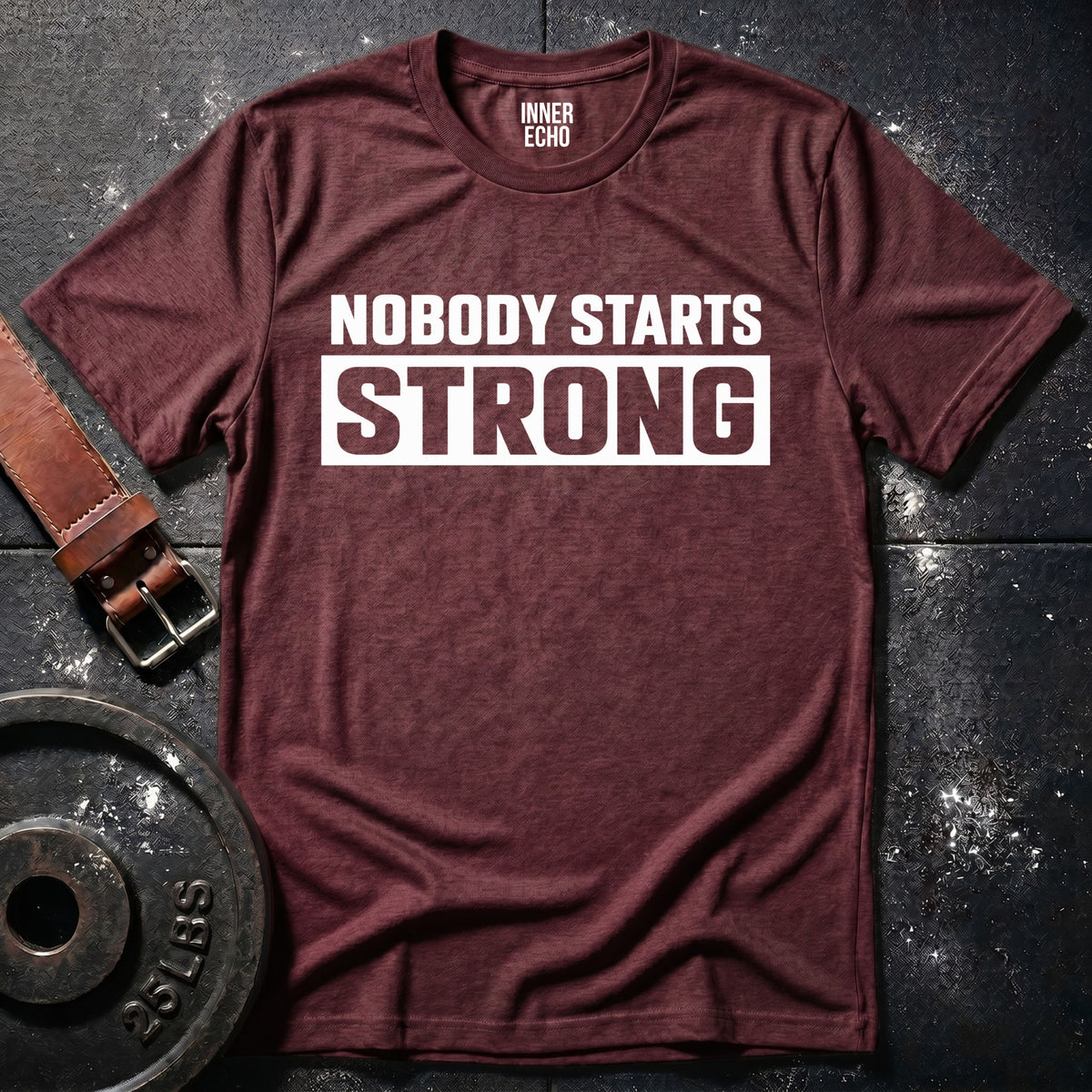 NOBODY STARTS STRONG — T-Shirt