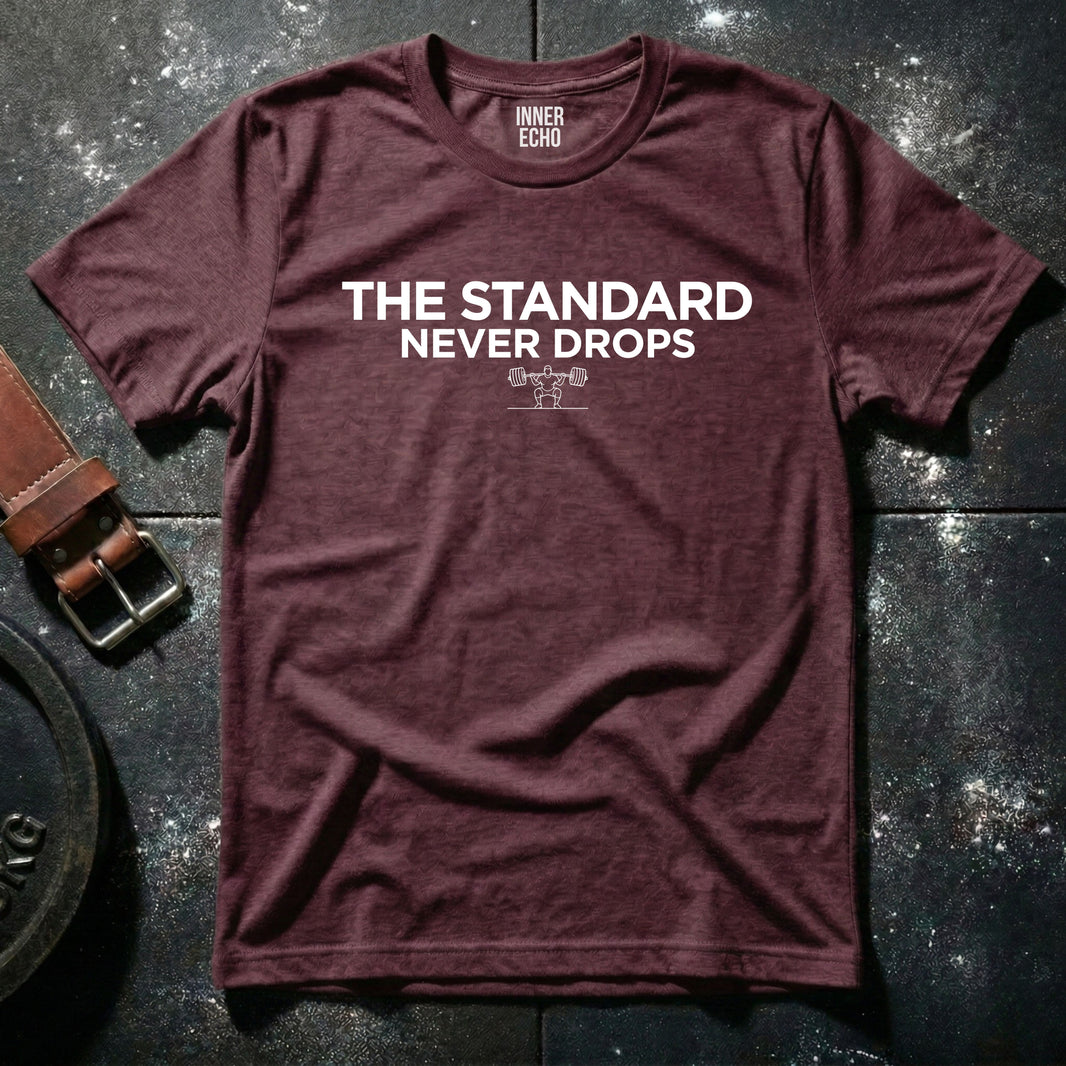 THE STANDARD NEVER DROPS  — T-Shirt